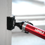 Close-up of red Level 5 Compound Applicator Tube with black outside corner applicator attachment applying mud to an outside corner