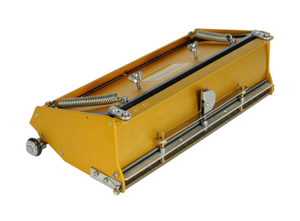 12-inch TapeTech EasyClean Finishing Box with gold aluminum body, brass blade holder, and crown control, quarter view