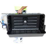 Person carrying TapeTech Mobile Wash Station from the table handle with black wash basin, hose, and sprayer attached