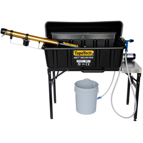 TapeTech Mobile Wash Station with a taper inside a black wash basin on a steel table with hose, sprayer, and a white bucket underneath