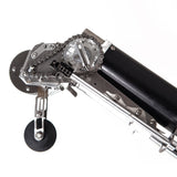 Close-up of the Columbia Automatic Taper head showing steel cutting blades and an extended black creaser wheel from the side view